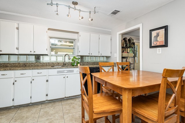 567 Peavy Rd, Dallas, TX 75218 - dining room featuring light tile patterned floors and ornamental molding
