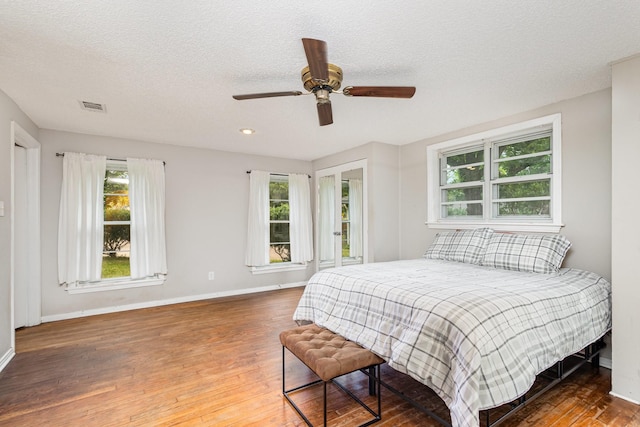 567 Peavy Rd, Dallas, TX 75218 - bedroom featuring wood-type flooring, a textured ceiling, ceiling fan, and recessed lighting