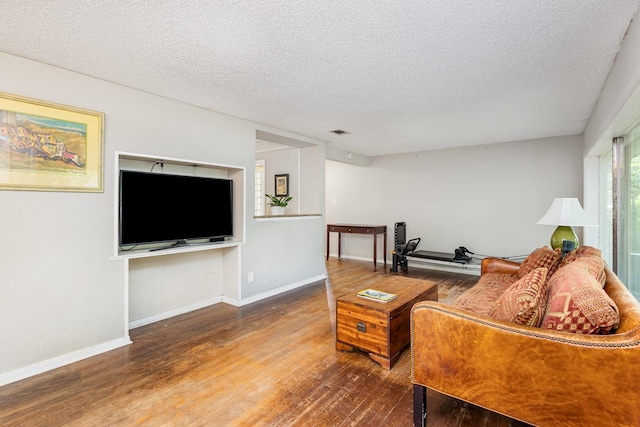 567 Peavy Rd, Dallas, TX 75218 - living area featuring wood finished floors and a textured ceiling
