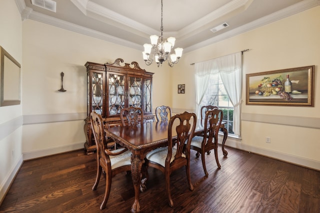 1535 Winding Creek Ln, Rockwall, TX 75032 - dining space with a chandelier, a tray ceiling, dark wood finished floors, and crown molding