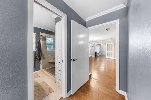 1440 Live Oak St, Sulphur Springs, TX 75482 - corridor with crown molding, a textured wall, a chandelier, and wood finished floors