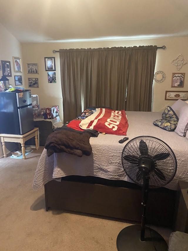 253 Pine Crest Dr, Justin, TX 76247 - carpeted bedroom featuring freestanding refrigerator