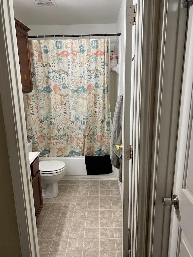 253 Pine Crest Dr, Justin, TX 76247 - bathroom featuring vanity, shower / tub combo with curtain, and tile patterned floors