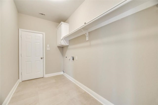 9204 Bottlebrush Ln, Irving, TX 75063 - laundry room featuring washer hookup, cabinet space, and hookup for a gas dryer