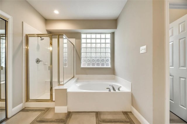 9204 Bottlebrush Ln, Irving, TX 75063 - bathroom featuring a garden tub, a shower stall, and recessed lighting