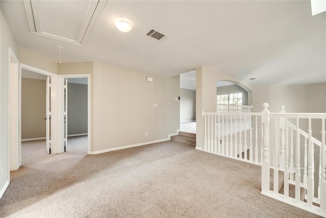 9204 Bottlebrush Ln, Irving, TX 75063 - carpeted empty room featuring attic access and baseboards