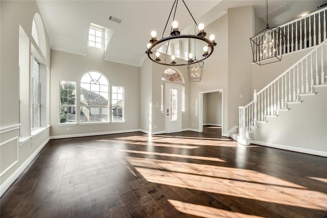 9204 Bottlebrush Ln, Irving, TX 75063 - entryway featuring a chandelier, dark wood-type flooring, a high ceiling, and stairs