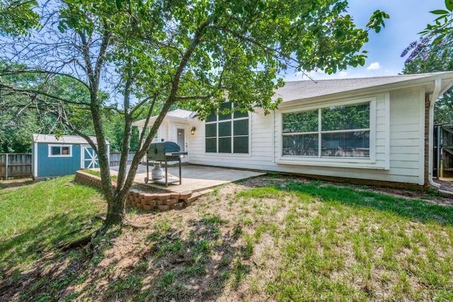 726 Texas Oak Trl, Lake Dallas, TX 75065 - back of house featuring a patio area and a storage unit