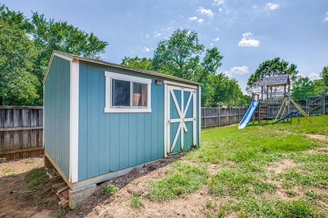 726 Texas Oak Trl, Lake Dallas, TX 75065 - view of shed featuring a fenced backyard and a playground