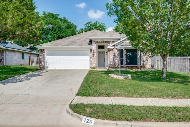 726 Texas Oak Trl, Lake Dallas, TX 75065 - view of front of home with concrete driveway, an attached garage, and brick siding