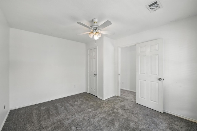 9846 Cedarcrest Dr, Providence Village, TX 76227 - unfurnished bedroom with dark carpet and ceiling fan