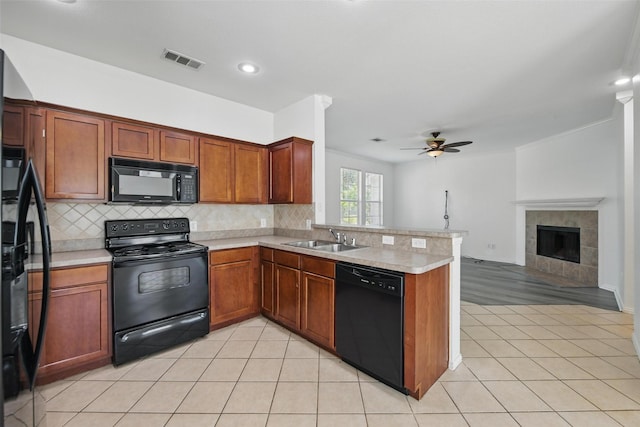 9846 Cedarcrest Dr, Providence Village, TX 76227 - kitchen featuring black appliances, a peninsula, light countertops, a ceiling fan, and open floor plan