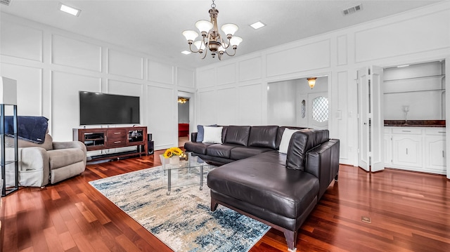 3705 Starlight Trl, Plano, TX 75023 - living room with a decorative wall, a chandelier, and dark wood-style floors