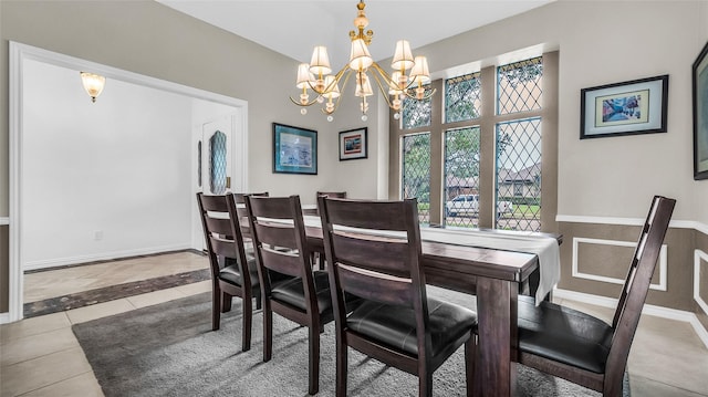 3705 Starlight Trl, Plano, TX 75023 - tiled dining room with a chandelier and baseboards