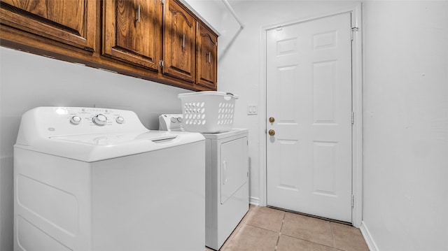 3705 Starlight Trl, Plano, TX 75023 - laundry room featuring cabinet space, independent washer and dryer, and light tile patterned flooring