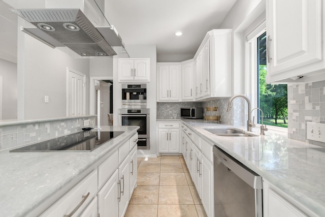 7955 Enclave Way, Dallas, TX 75218 - kitchen with stainless steel appliances, custom range hood, backsplash, white cabinets, and recessed lighting