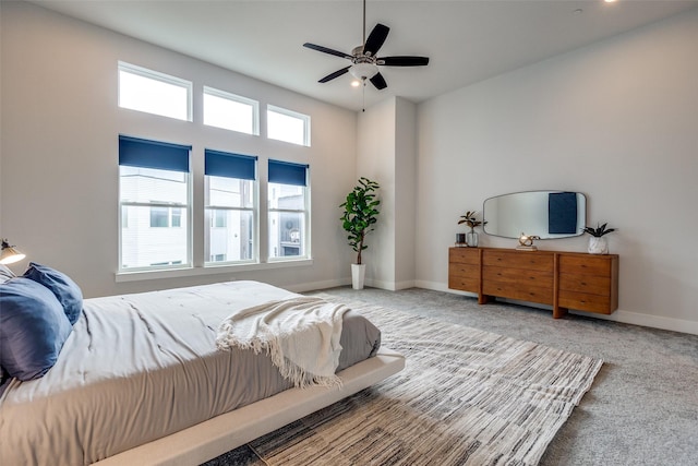 381 E Greenbriar Ln Unit 501, Dallas, TX 75203 - carpeted bedroom featuring baseboards and a ceiling fan