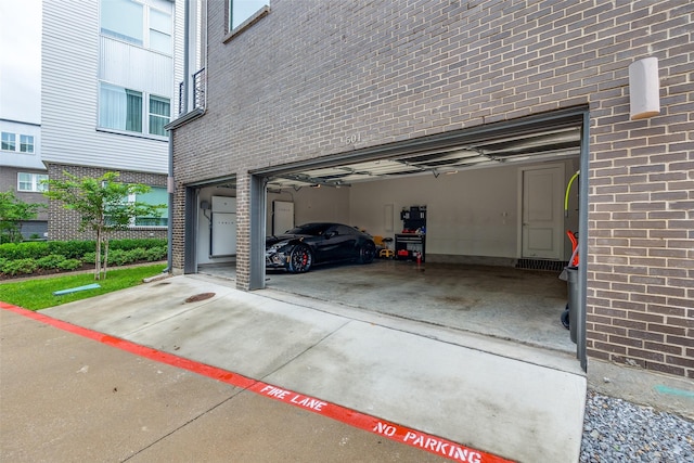 381 E Greenbriar Ln Unit 501, Dallas, TX 75203 - garage featuring concrete driveway
