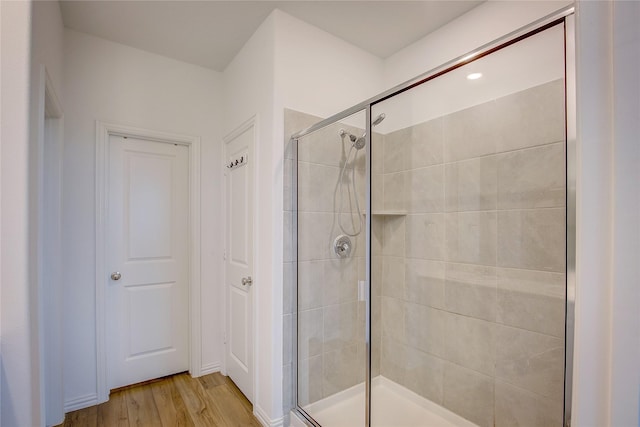 5221 Rockrose Ln, Princeton, TX 75407 - bathroom featuring a stall shower and wood finished floors