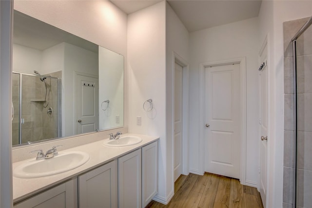 5221 Rockrose Ln, Princeton, TX 75407 - full bath featuring a shower stall, wood finished floors, and double vanity
