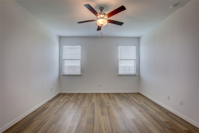 5221 Rockrose Ln, Princeton, TX 75407 - empty room featuring light wood-style flooring, healthy amount of natural light, a ceiling fan, and a smoke detector