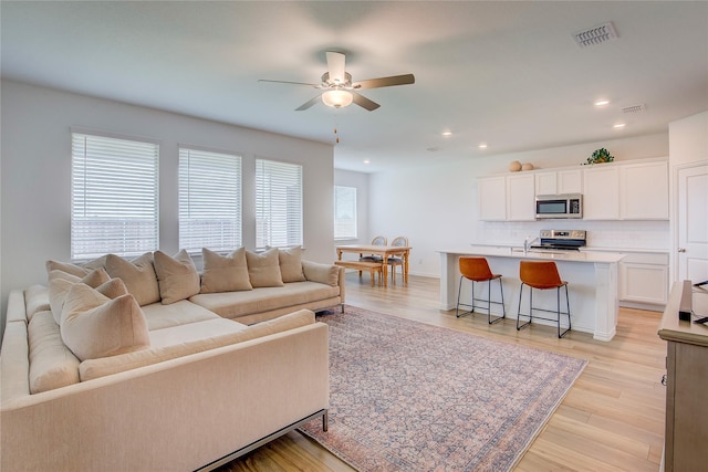 5221 Rockrose Ln, Princeton, TX 75407 - living room with ceiling fan, recessed lighting, and light wood-type flooring