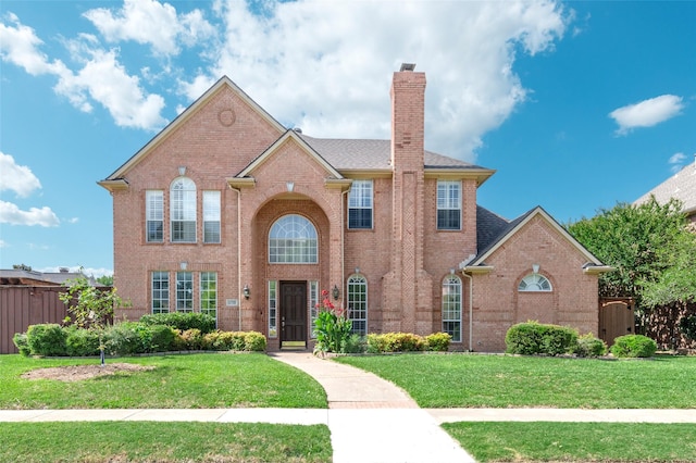 5729 Ridgehaven Dr, Plano, TX 75093 - view of front of house featuring brick siding and a chimney