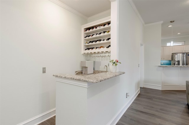 5729 Ridgehaven Dr, Plano, TX 75093 - bar with stainless steel fridge, ornamental molding, dark wood-style floors, recessed lighting, and hanging light fixtures