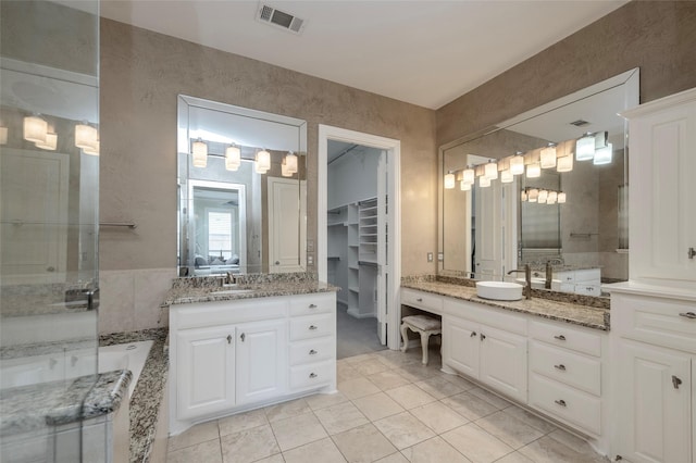 5729 Ridgehaven Dr, Plano, TX 75093 - full bathroom featuring two vanities, a stall shower, tile patterned floors, and a garden tub
