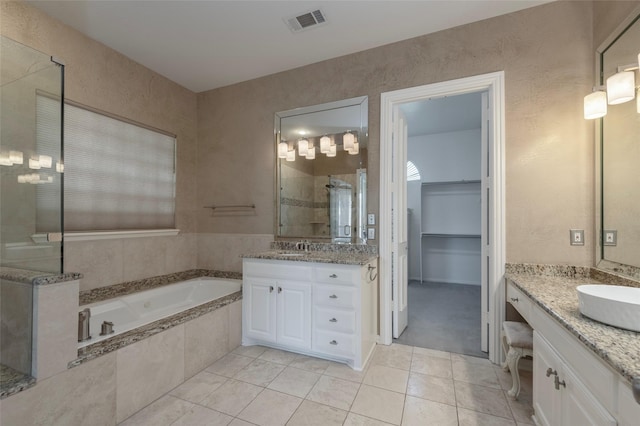 5729 Ridgehaven Dr, Plano, TX 75093 - bathroom with tile patterned floors, two vanities, a stall shower, and a garden tub