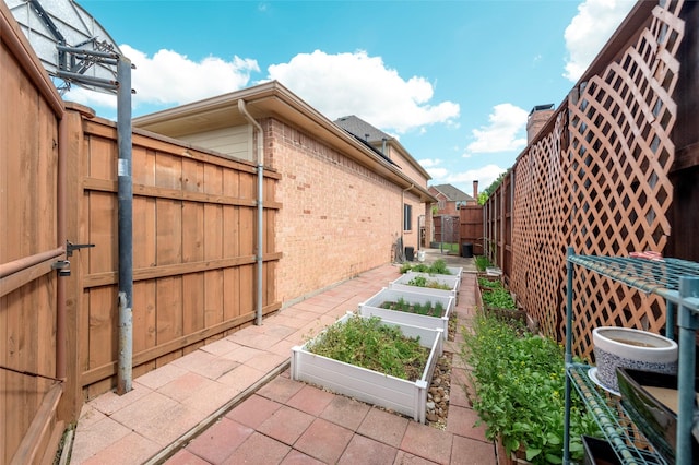 5729 Ridgehaven Dr, Plano, TX 75093 - fenced backyard with a vegetable garden