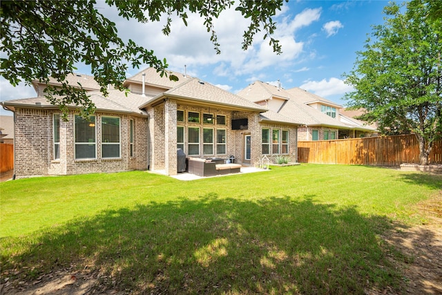 7317 Plumas Pl, Mckinney, TX 75070 - back of property featuring an outdoor hangout area, a fenced backyard, brick siding, a patio area, and a shingled roof