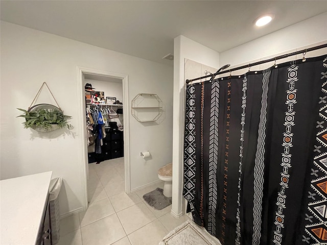 803 Odlozil Ln, Ennis, TX 75119 - bathroom featuring tile patterned floors, vanity, a walk in closet, and curtained shower