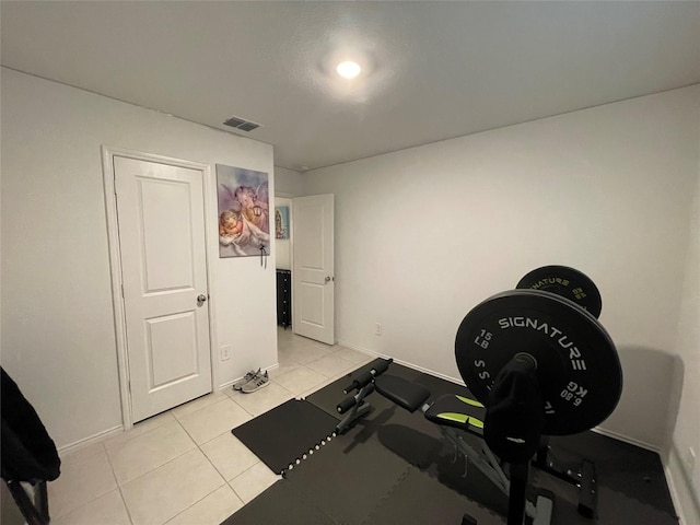 803 Odlozil Ln, Ennis, TX 75119 - exercise room with light tile patterned floors and baseboards