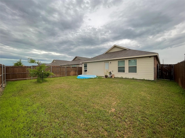 803 Odlozil Ln, Ennis, TX 75119 - rear view of house with a fenced backyard and a pool