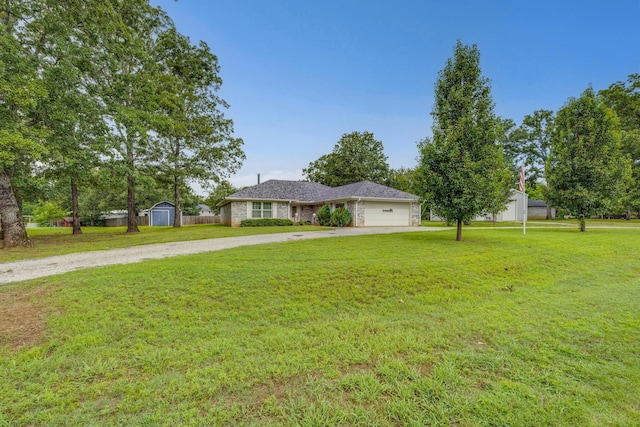 15 Cumberland Cir, Denison, TX 75021 - single story home featuring driveway, a storage shed, a garage, and a front lawn