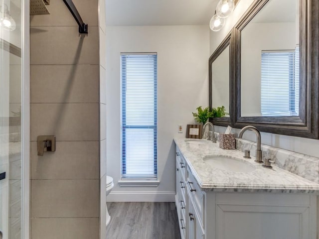 2614 San Saba St, Mesquite, TX 75150 - full bath with double vanity, wood finished floors, and a shower stall