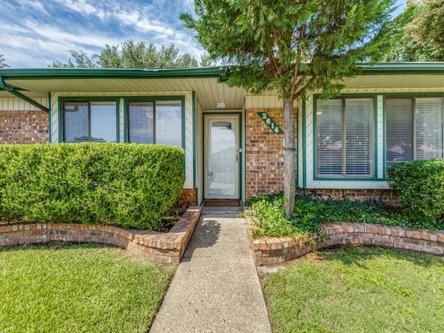 2614 San Saba St, Mesquite, TX 75150 - property entrance featuring brick siding and a yard