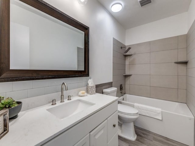 2614 San Saba St, Mesquite, TX 75150 - bathroom featuring wood finished floors, vanity, and shower / bathtub combination