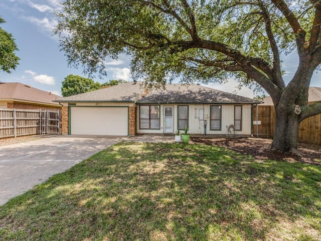 2614 San Saba St, Mesquite, TX 75150 - ranch-style house with a garage and driveway