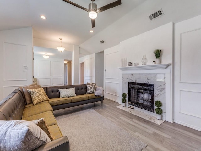 2614 San Saba St, Mesquite, TX 75150 - living room with wood finished floors, ceiling fan, vaulted ceiling, a fireplace, and recessed lighting