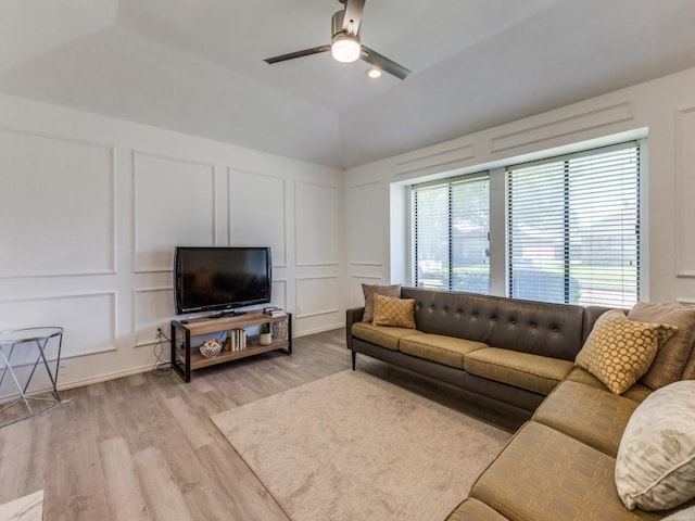 2614 San Saba St, Mesquite, TX 75150 - living room featuring a decorative wall, a ceiling fan, light wood-style flooring, and vaulted ceiling