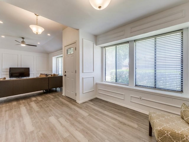 2614 San Saba St, Mesquite, TX 75150 - living area with a decorative wall, light wood-type flooring, and ceiling fan