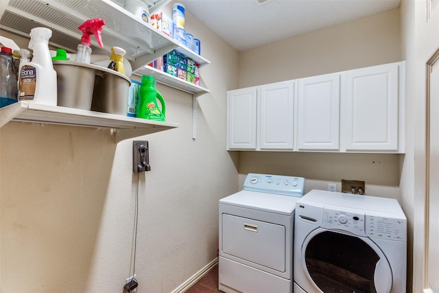 6707 Canyon Crest Dr, Fort Worth, TX 76132 - laundry room with washing machine and clothes dryer, cabinet space, and wood finished floors