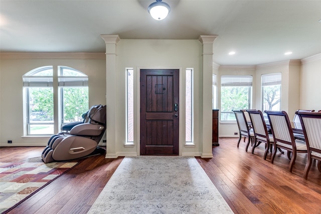 6707 Canyon Crest Dr, Fort Worth, TX 76132 - foyer entrance featuring dark wood-type flooring, ornamental molding, and ornate columns