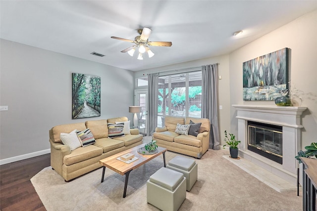 5513 Hill Haven Ct, Frisco, TX 75035 - living area featuring a glass covered fireplace, ceiling fan, and wood finished floors