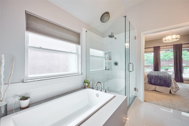 5513 Hill Haven Ct, Frisco, TX 75035 - ensuite bathroom featuring a garden tub, a stall shower, tile patterned flooring, and lofted ceiling