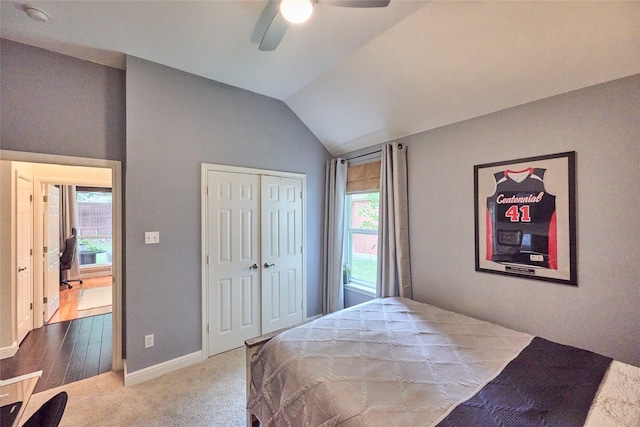 5513 Hill Haven Ct, Frisco, TX 75035 - bedroom featuring multiple windows, vaulted ceiling, a closet, a ceiling fan, and carpet