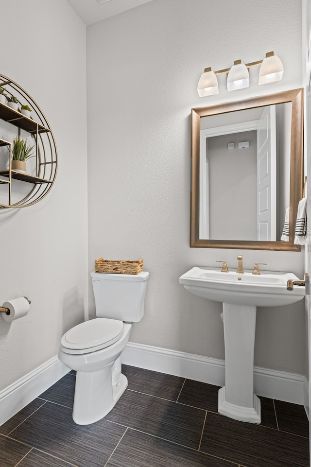 309 Red River Cir Trail, Highland Village, TX 75077 - half bathroom with toilet and tile patterned floors