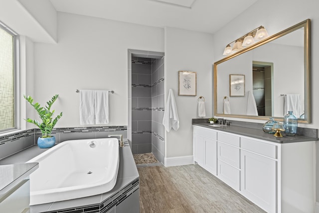 309 Red River Cir Trail, Highland Village, TX 75077 - full bathroom with vanity, a bath, plenty of natural light, and wood finished floors
